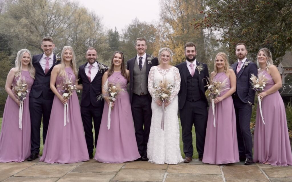 The bride and groom with their bridesmaids and groomsmen at Hackness Grange