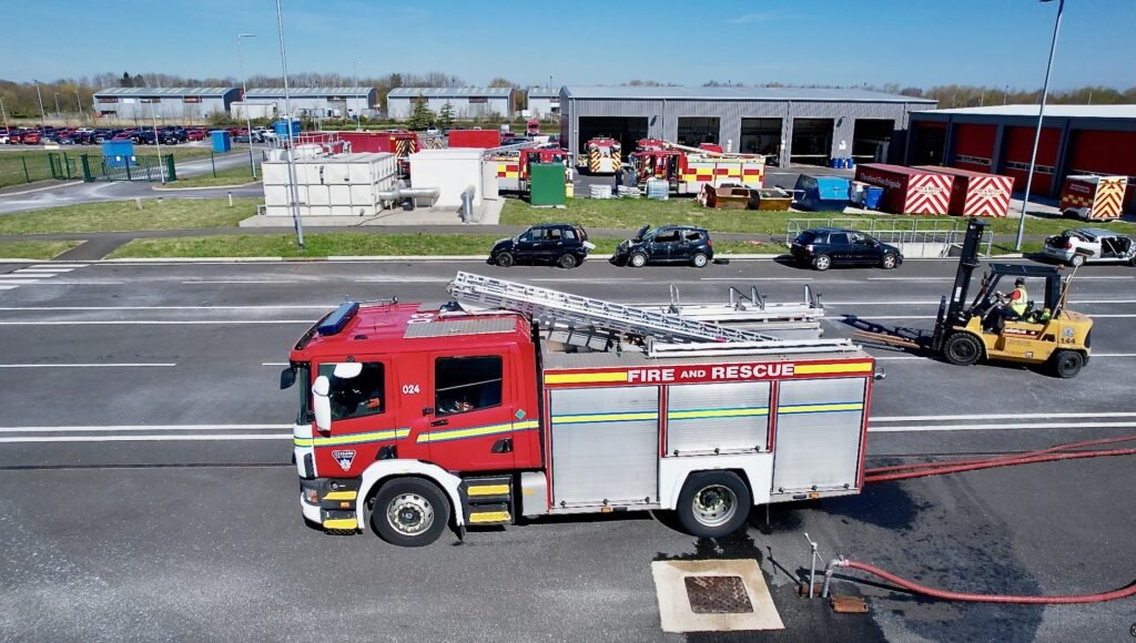 A fire engine at a fire station, filmed from a drone