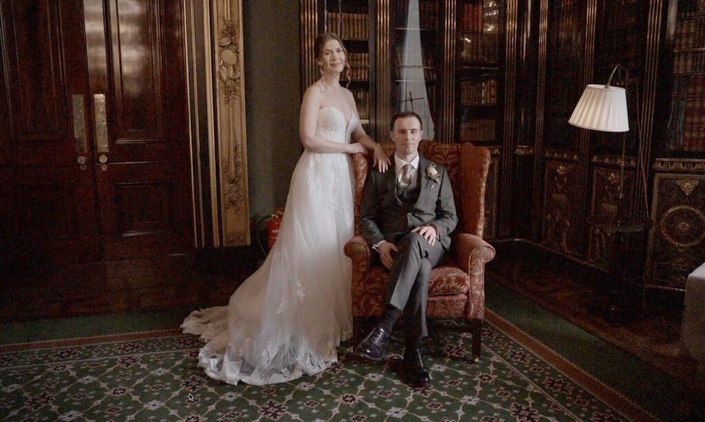 Bride and groom in a wood-panelled library